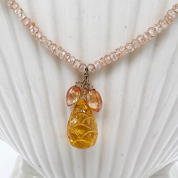 Nude-colored faceted CZ with hanging Citrine Briolettes